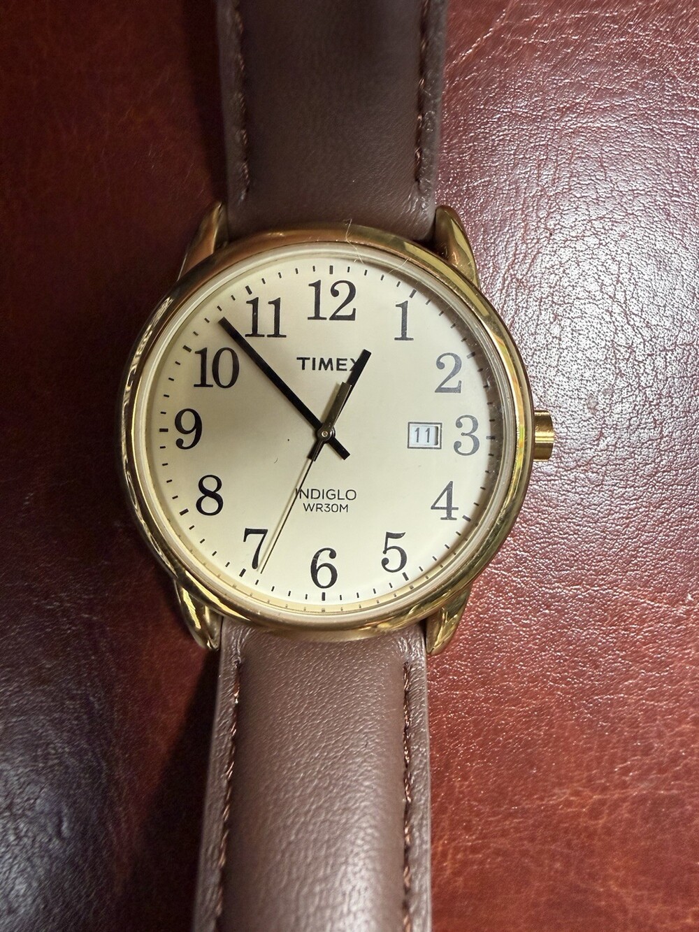Timex Indiglo Quartz Date 30M Gold Tone Stainless Case White Dial Brown Leather